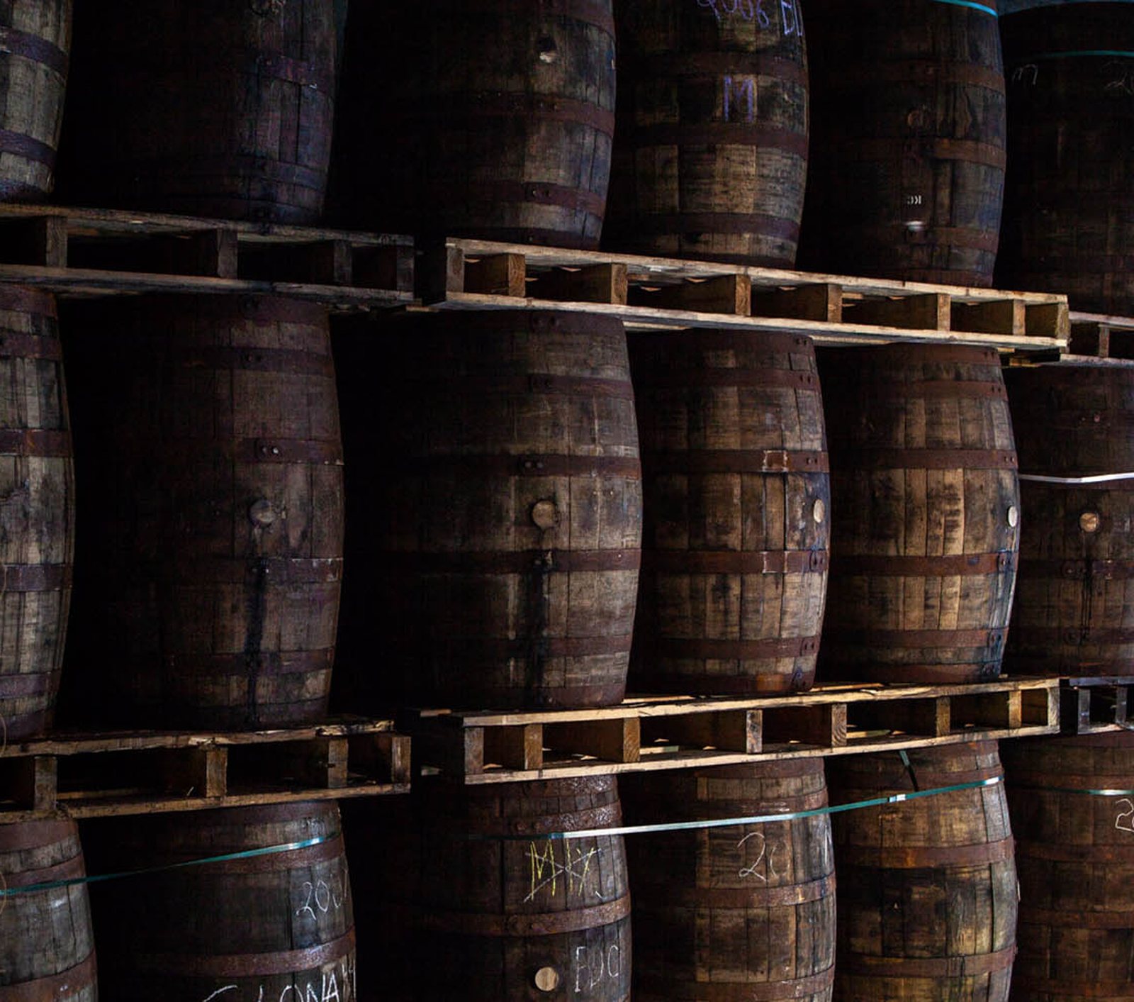 Casks of Clonakilty whiskey stacked on pallets in the Atlantic Coast maturation warehouse